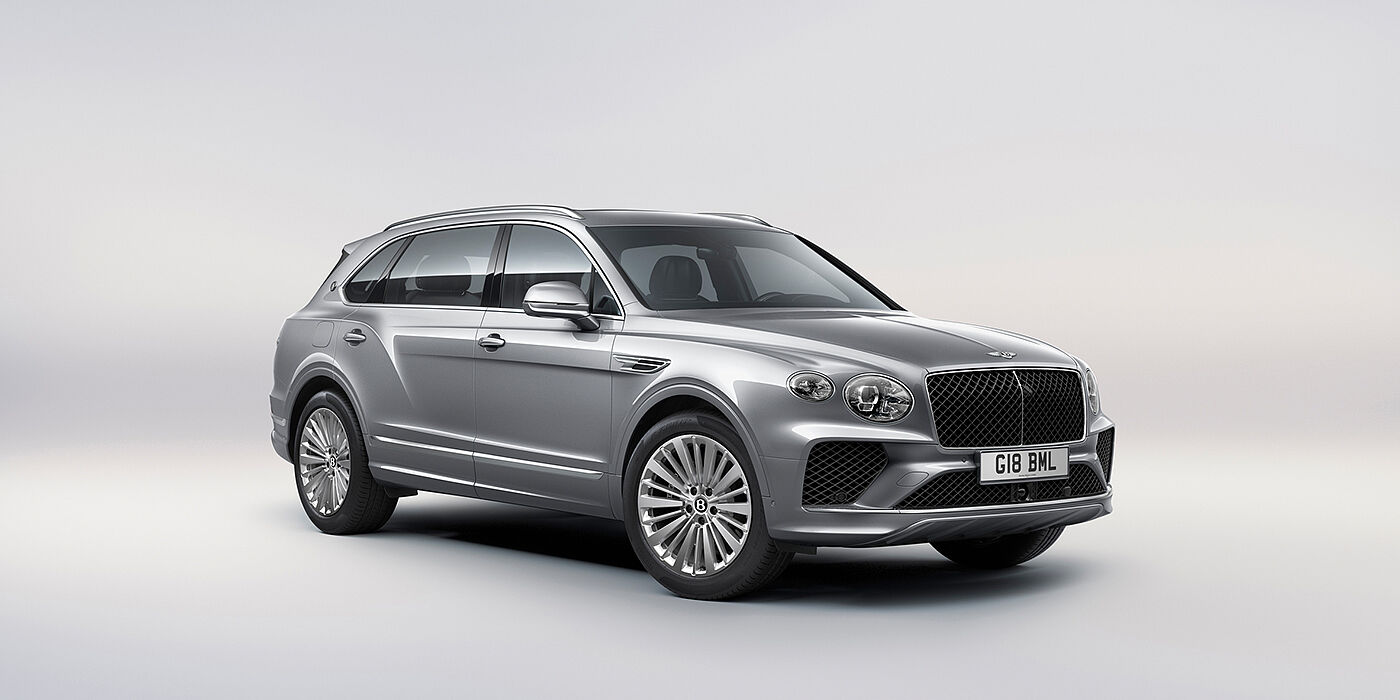 Bentley Macau Bentley Bentayga Extended Wheelbase luxury SUV front three quarter view in Moonbeam paint with 21 inch five spoke painted wheels