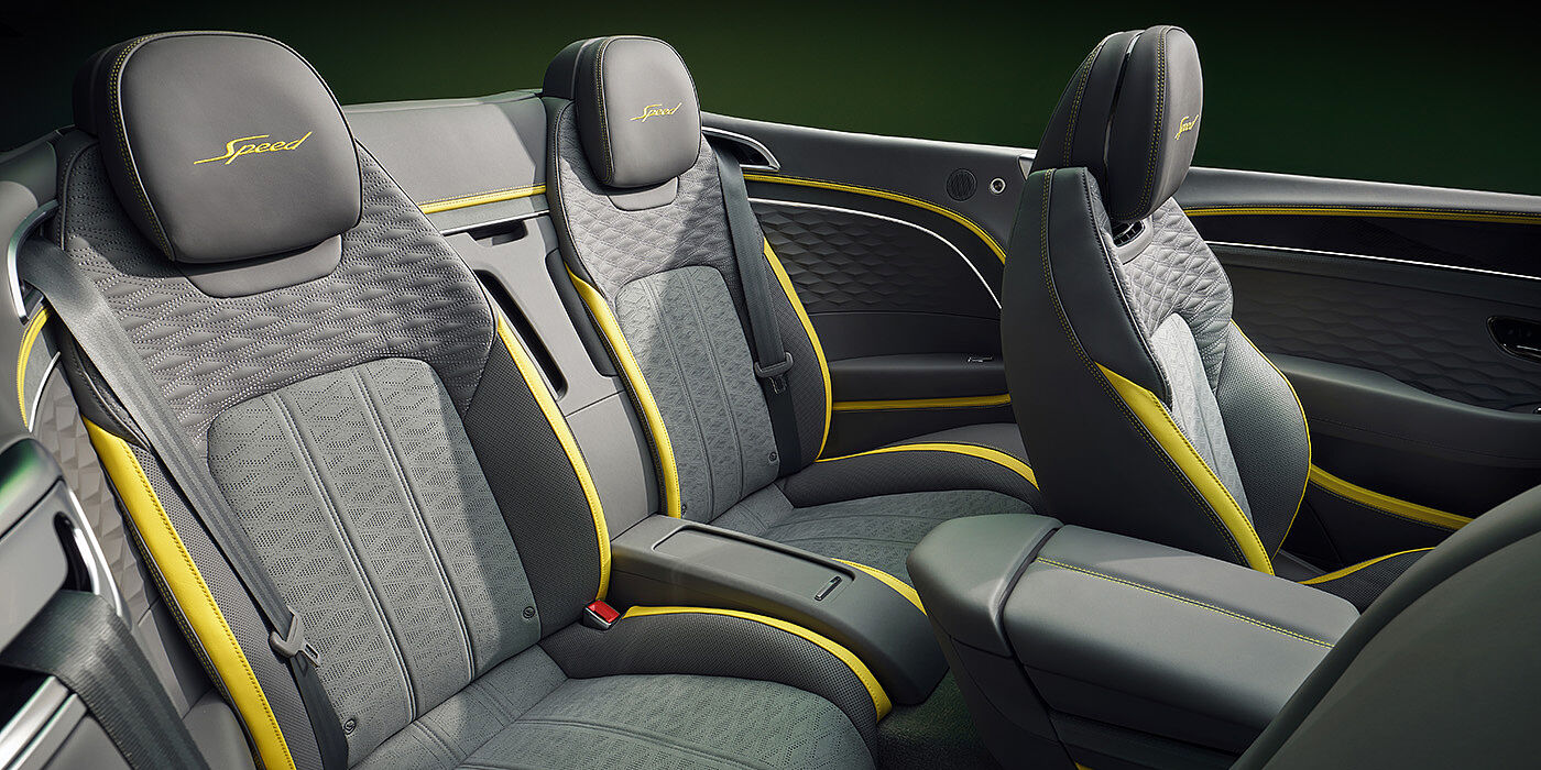 Bentley Macau Bentley New Continental GTC Speed convertible rear interior with unique Speed colour split in Gravity Grey and Cyber Yellow hide colours, and contrast stitched headrest emblems 