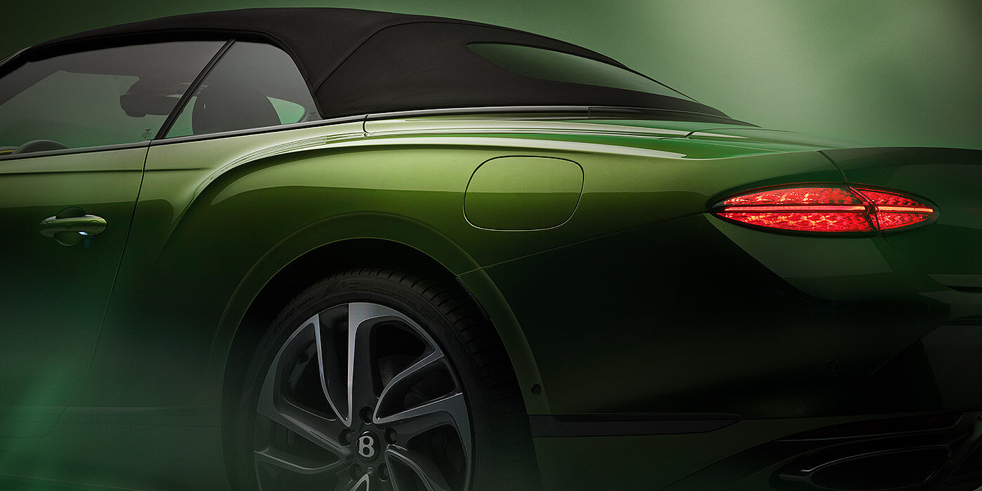 Bentley Macau Bentley New Continental GTC Speed rear haunch and tail lamp in Tourmaline Green paint and dark tint brightware with black hood up and illuminated head lamps