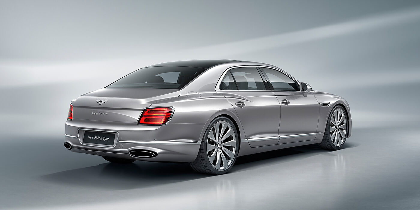 Bentley Macau New Bentley Flying Spur sedan rear view in Silverlake paint with ten spoke wheels and chrome matrix grille