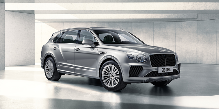 Bentley Macau Bentley Bentayga Extended Wheelbase SUV front three quarter in Moonbeam paint with a grey background