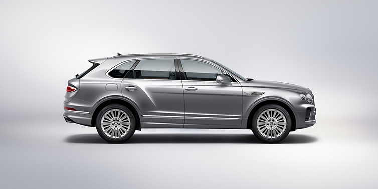 Bentley Macau Bentley Bentayga SUV side profile in Moonbeam silver paint against white background featuring 21 inch 5 spoke wheels